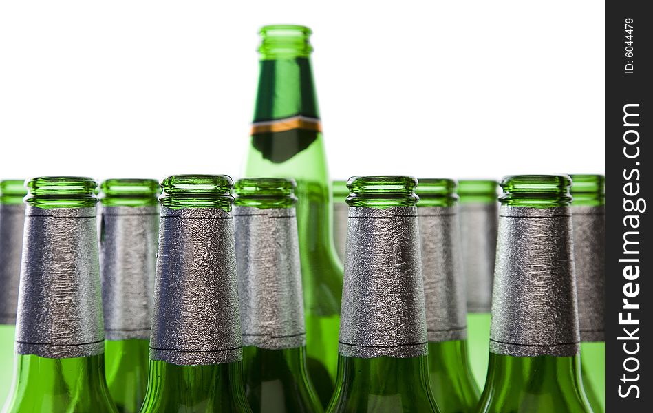 Concept of Glass Recycling or Alcohol Production - Green Glass Bottles Isolated on White. Concept of Glass Recycling or Alcohol Production - Green Glass Bottles Isolated on White