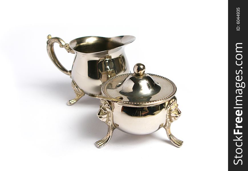 Silver Milk cup and sugar basin on a white background