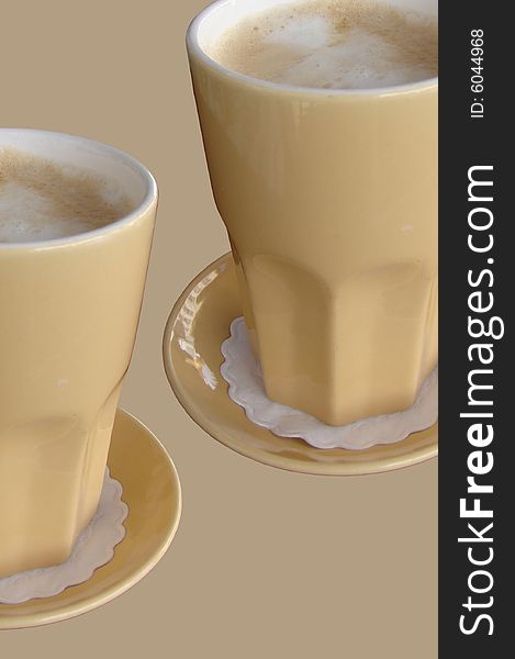 Two Delicious cafe latte isolated with a brown background. Two Delicious cafe latte isolated with a brown background