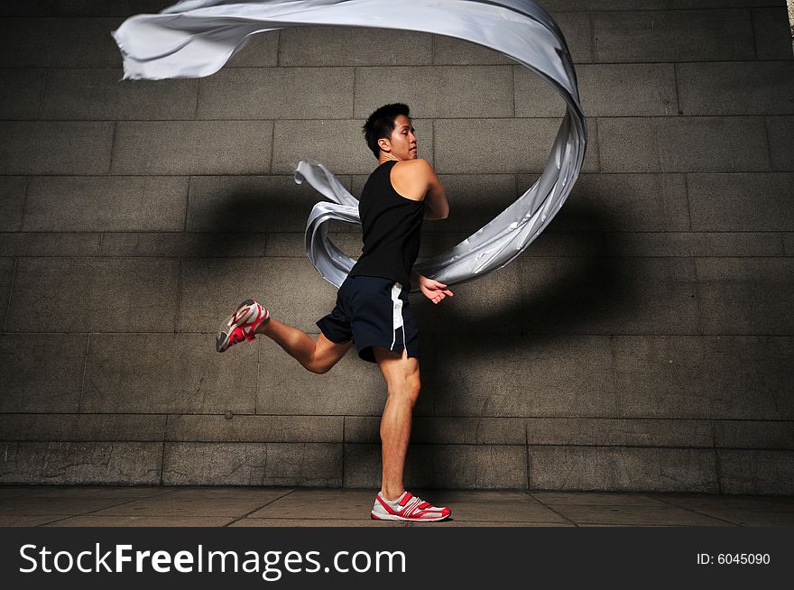 Pictures of people swirling fabric in motion. Useful for context on creativity or artistic expression or freeze motion. Pictures of people swirling fabric in motion. Useful for context on creativity or artistic expression or freeze motion.