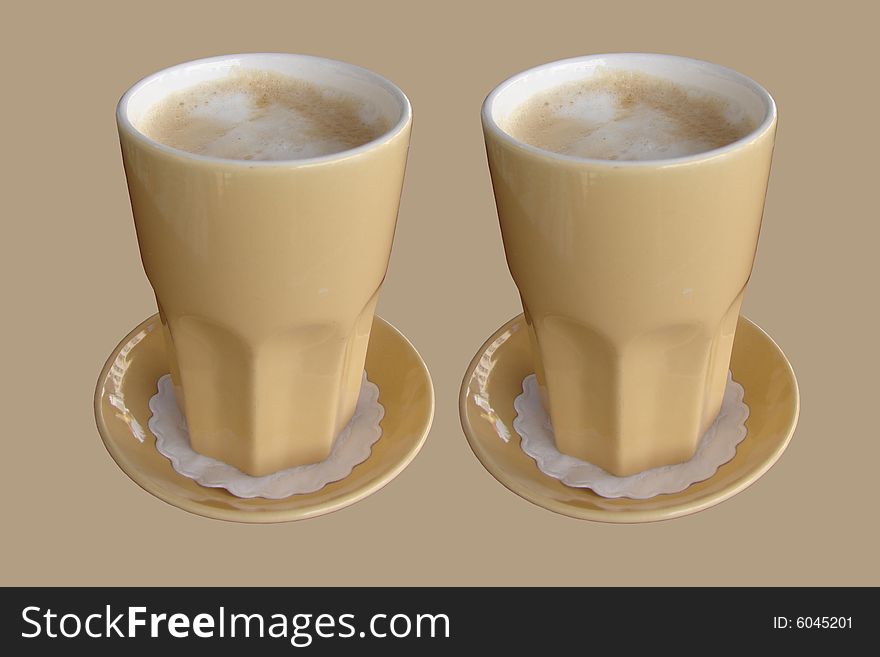 Two Delicious cafe latte isolated with a brown background. Two Delicious cafe latte isolated with a brown background