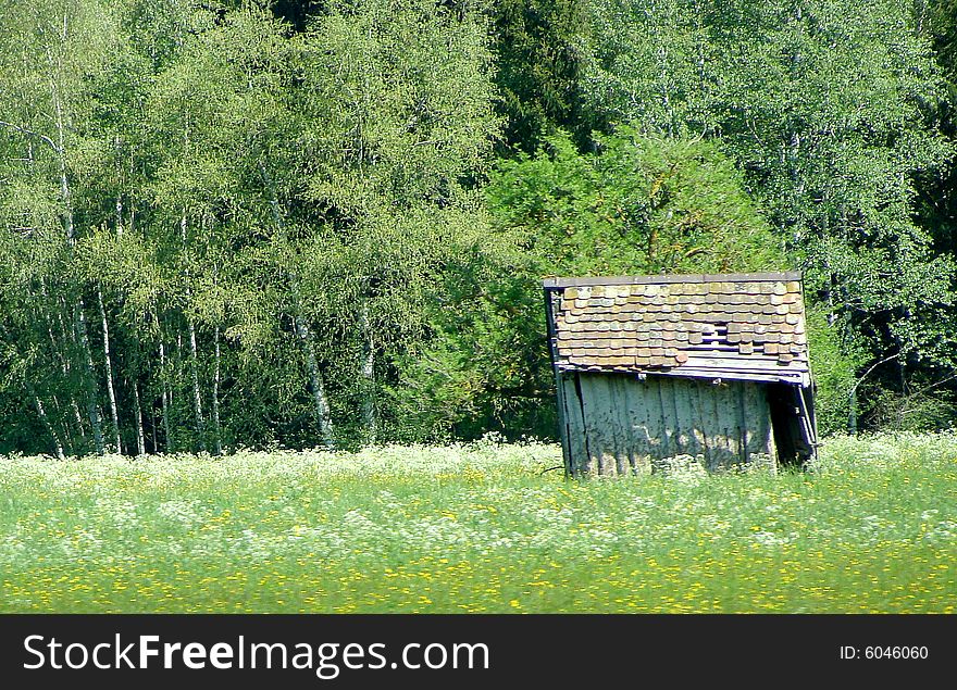 Small old shed on a meadow. Small old shed on a meadow.