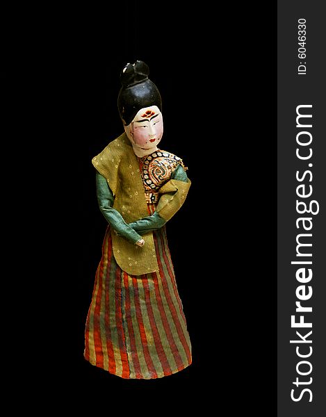 Pottery figure of a woman in tang costume on black background