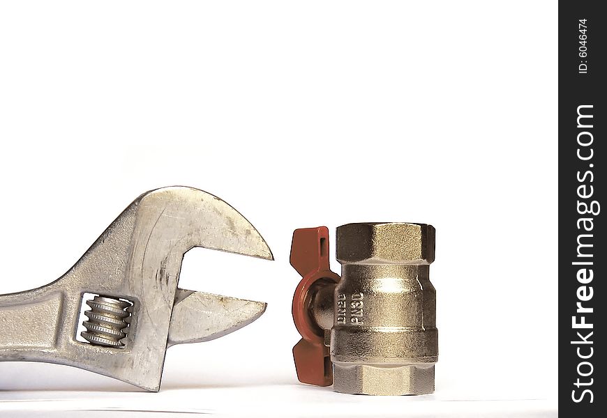 Adjustable spanner and valve on a white background