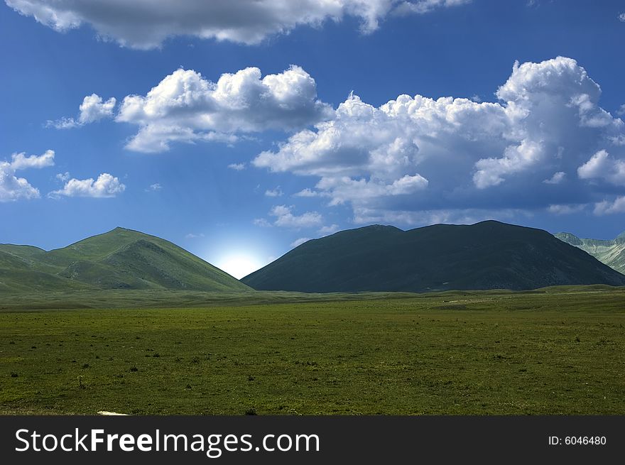 Magnificent view of a mountain with blue sky in the background.