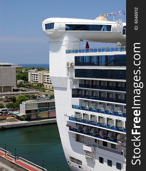 The cruise liner's back with San Juan downtown in a background (Puerto Rico).