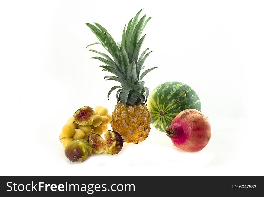 Composition from fresh pineapple, yellow dates and a fig. Composition from fresh pineapple, yellow dates and a fig