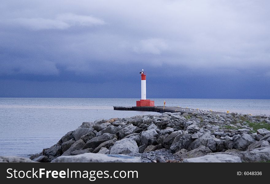 A lighthouse and shoreline on Lake Ontario in Canada. A lighthouse and shoreline on Lake Ontario in Canada