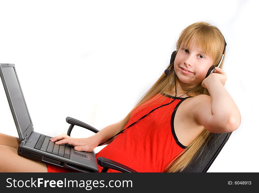 Pretty teenageï¿½ girl with laptop sitting in chair isolated over white. Pretty teenageï¿½ girl with laptop sitting in chair isolated over white