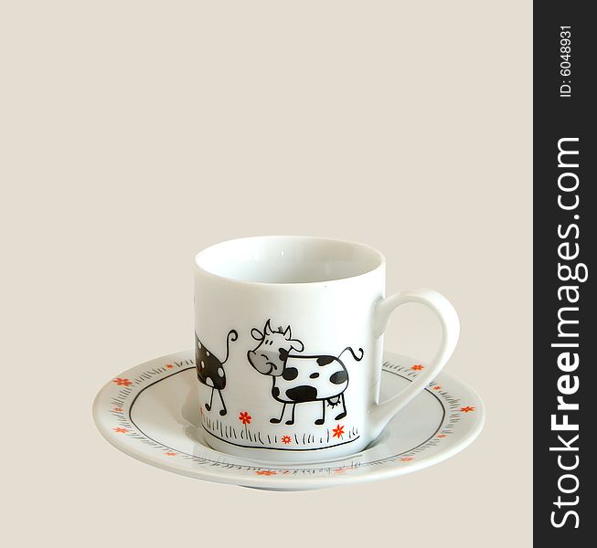 White cup for espresso with picture of cow on it