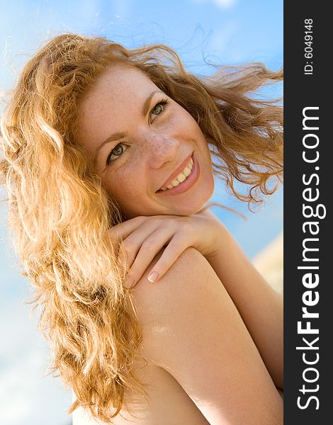 Pretty caucasian red-haired girl outdoor portrait