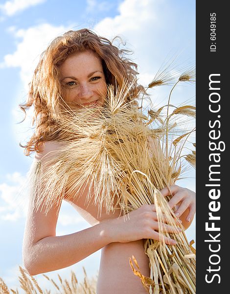 Beautiful caucasian model in golden wheat field. Beautiful caucasian model in golden wheat field