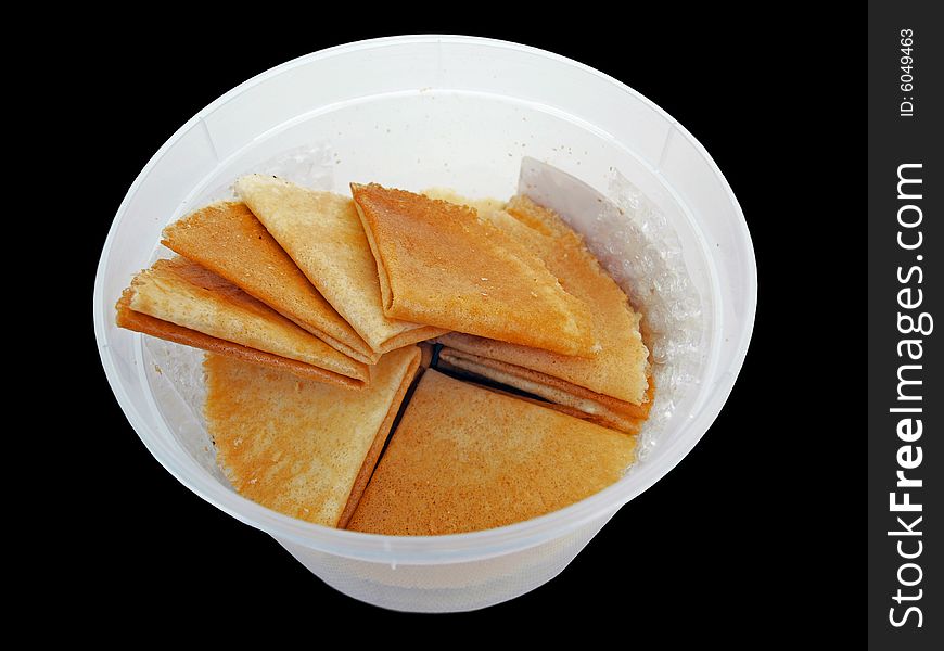 Asian flat & thin Cookies in white plastic Container perspective view. Asian flat & thin Cookies in white plastic Container perspective view