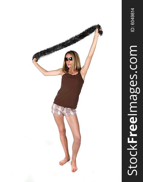 Teen in sunglasses lifting scarf over head. Teen in sunglasses lifting scarf over head