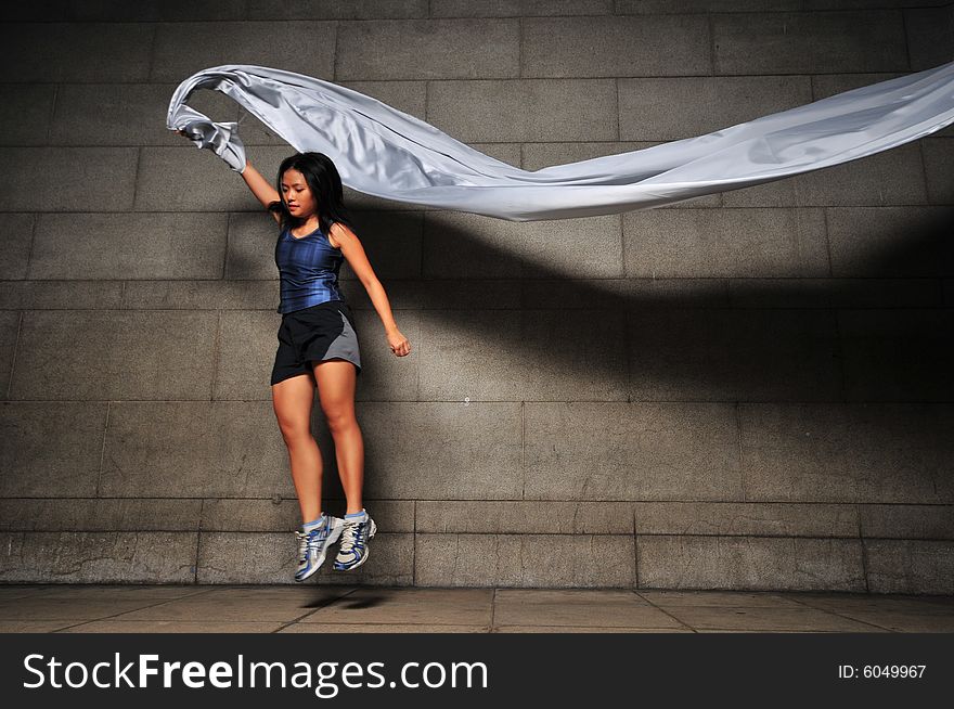 Pictures of people swirling fabric in motion. Useful for context on creativity or artistic expression or freeze motion. Pictures of people swirling fabric in motion. Useful for context on creativity or artistic expression or freeze motion.