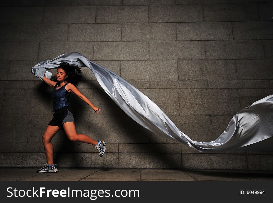 Pictures of people swirling fabric in motion. Useful for context on creativity or artistic expression or freeze motion. Pictures of people swirling fabric in motion. Useful for context on creativity or artistic expression or freeze motion.