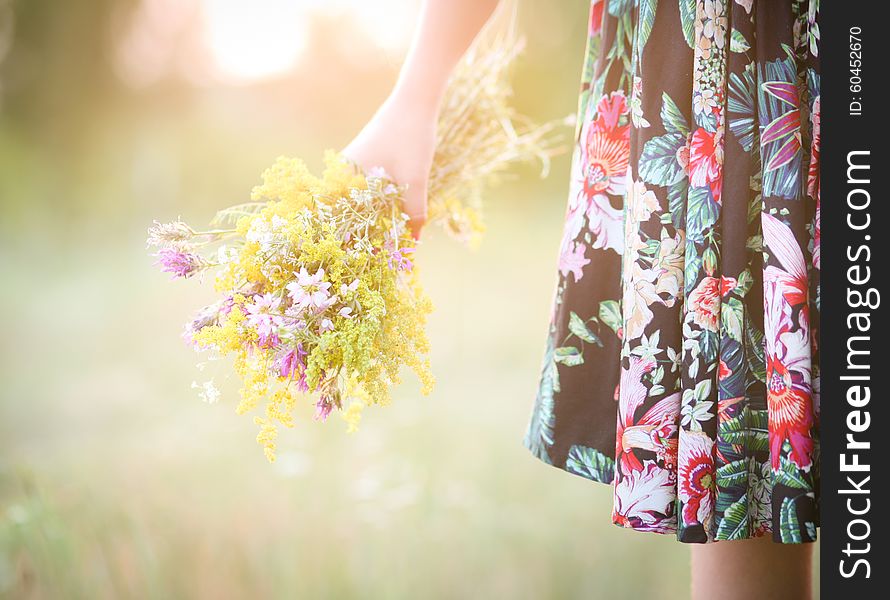 Girl With A Bouquet Of Flowers