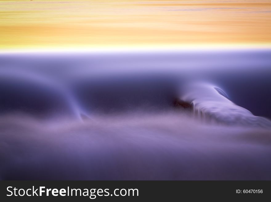 An abstract detail of water flowing over a dam. An abstract detail of water flowing over a dam.