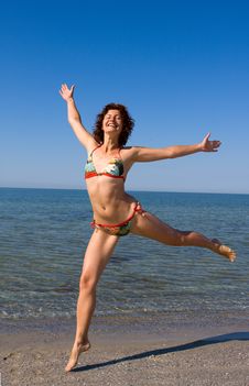 Happy Smiling Girl Jumping At Sea Beach Royalty Free Stock Photos Happy Smiling Girl Jumping At Sea Beach Royalty Free Stock Photos