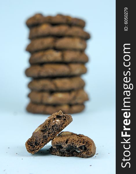 Choc chip cookies isolated against a blue background