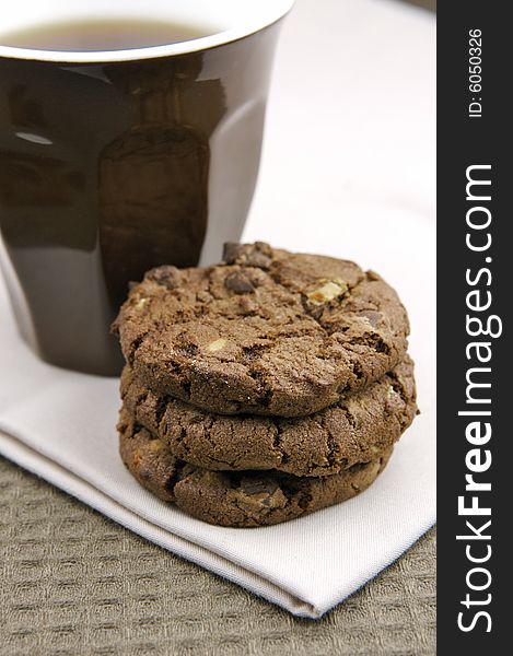 Choc chip cookies isolated against a blue background