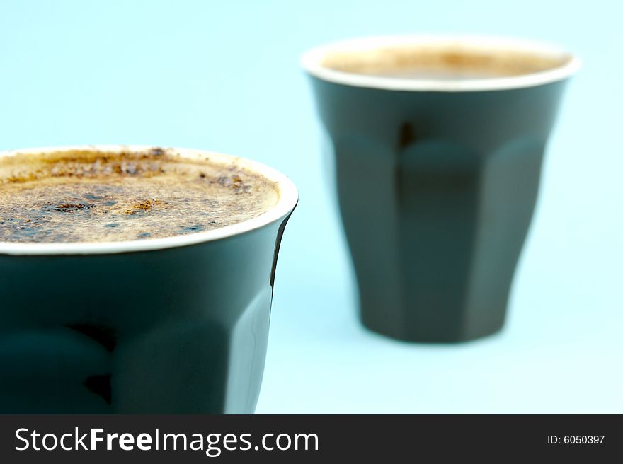 Cappuccino isolated against a blue background