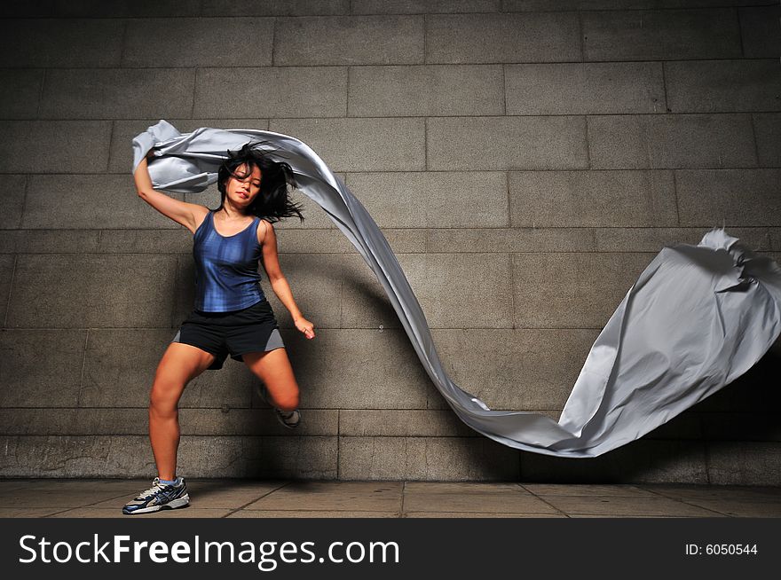 Pictures of people swirling fabric in motion. Useful for context on creativity or artistic expression or freeze motion. Pictures of people swirling fabric in motion. Useful for context on creativity or artistic expression or freeze motion.