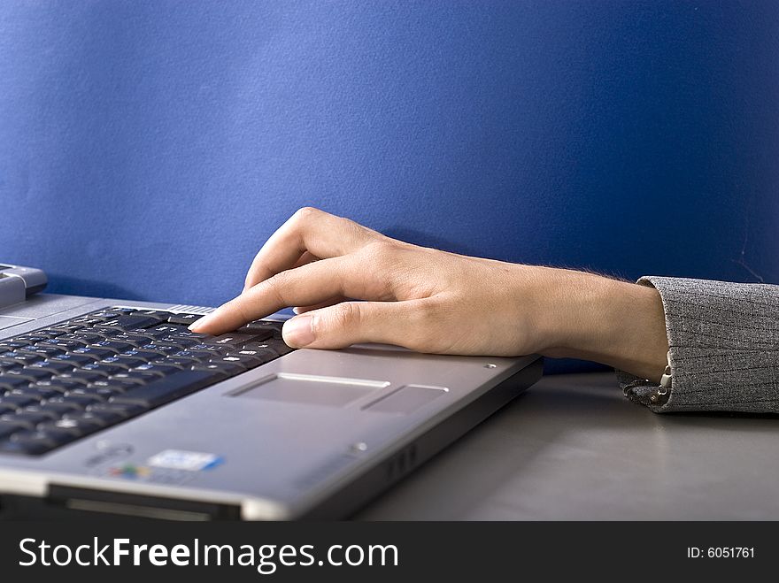 Woman typing on her laptop. Woman typing on her laptop