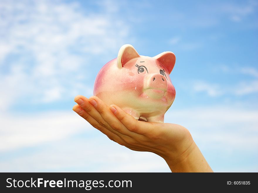 Saving money  woman hands holding piggy bank. Saving money  woman hands holding piggy bank