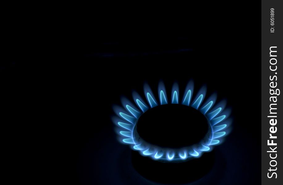 Flames of gas stove in the dark