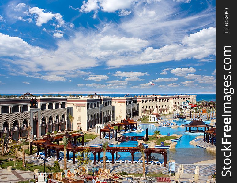 Territory of hotel with swimming pool on the sea coast