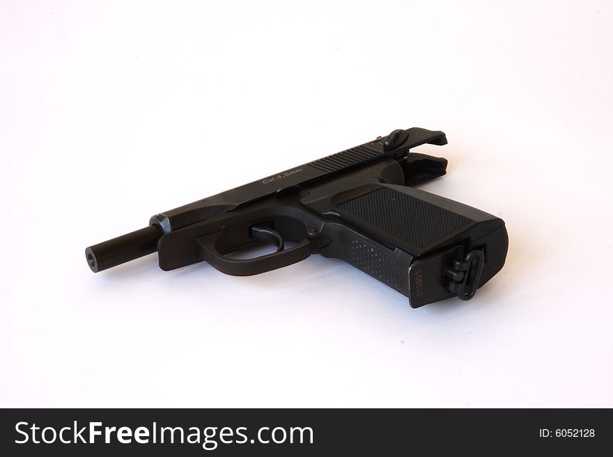 Black gun on the white background