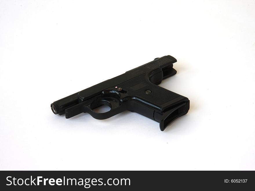 Black gun on the white background