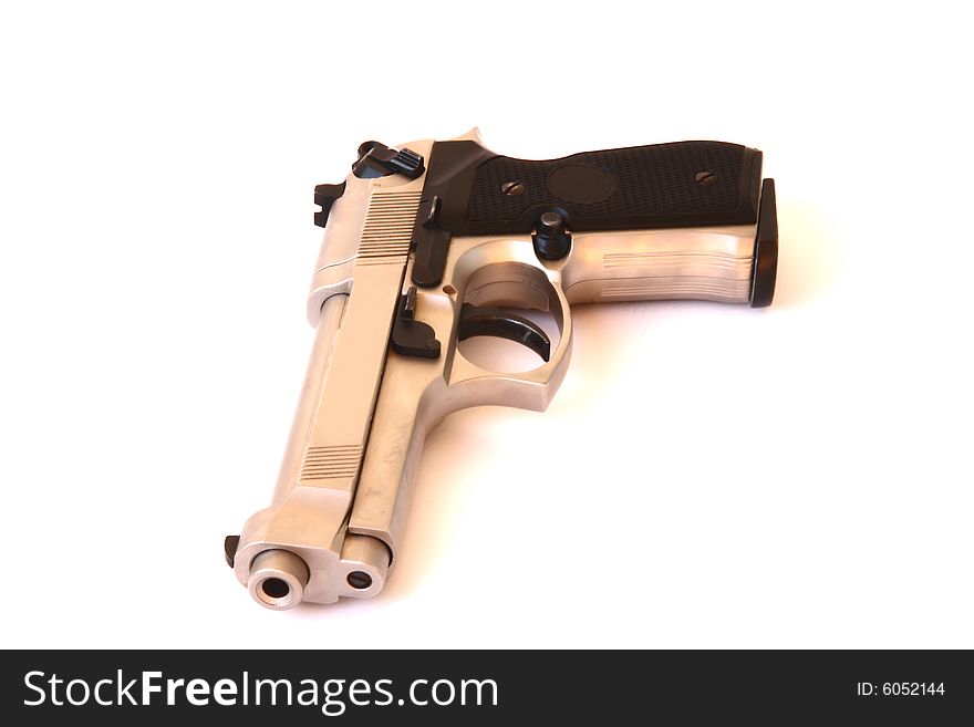 Nickel-plated gun on the white background