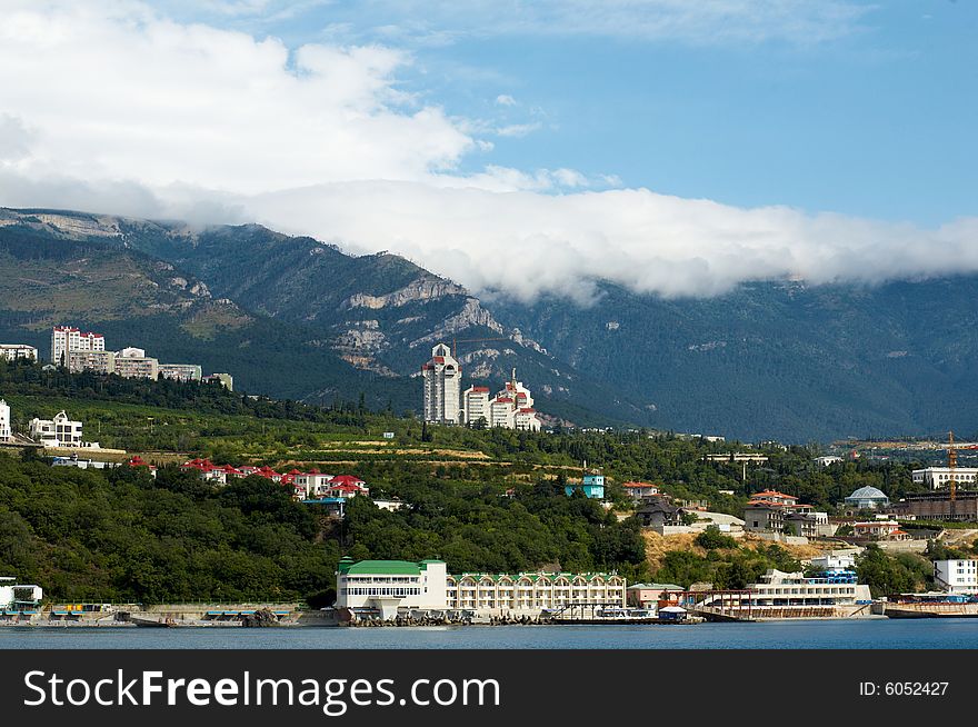 An image of big city near blue sea. An image of big city near blue sea