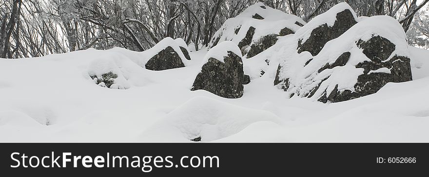 Rocks in the freshly fallen snow creating nice panoramic image. Rocks in the freshly fallen snow creating nice panoramic image.