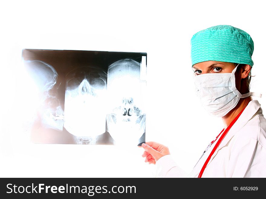 A beautiful young doctor with a red stethoscope and a xray image in the back. Isolated over white. A beautiful young doctor with a red stethoscope and a xray image in the back. Isolated over white.