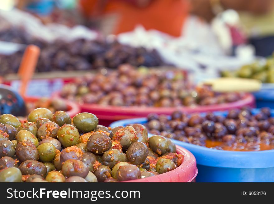 Spanish olives on red hot chili pepper sauce and green mojo. Spanish olives on red hot chili pepper sauce and green mojo