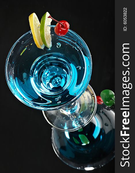Still life with glass with drink on the black background
