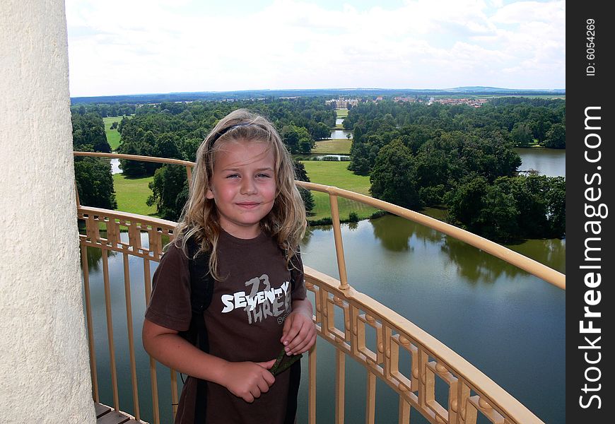 Boy standing on the top of the Minaret with view of Lednice castle. Boy standing on the top of the Minaret with view of Lednice castle