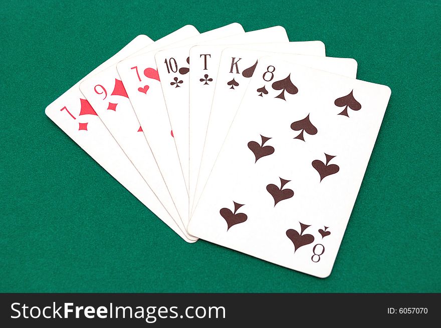 Playing cards isolated over a green background