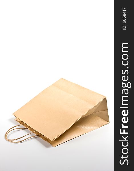 Paper shopping bag on white