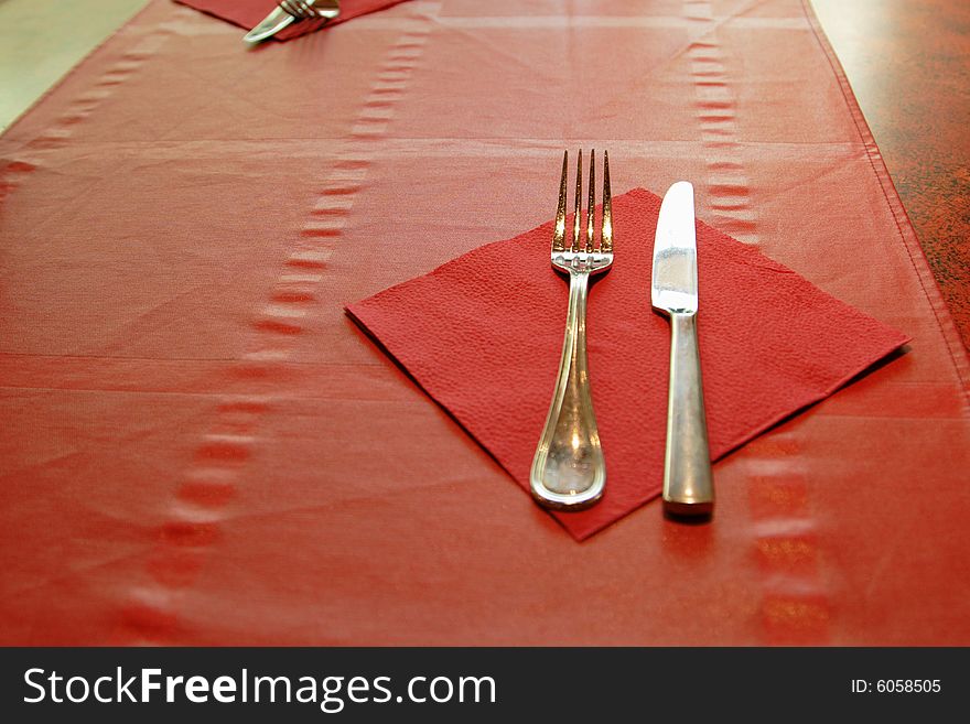 Tableware on red tablecloth in the restaurant. Tableware on red tablecloth in the restaurant