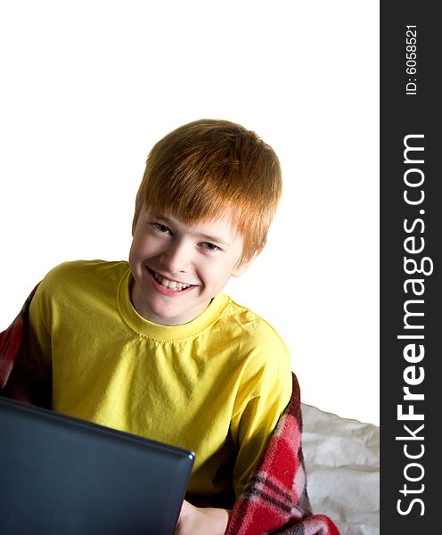 Smiling teenager with a laptop