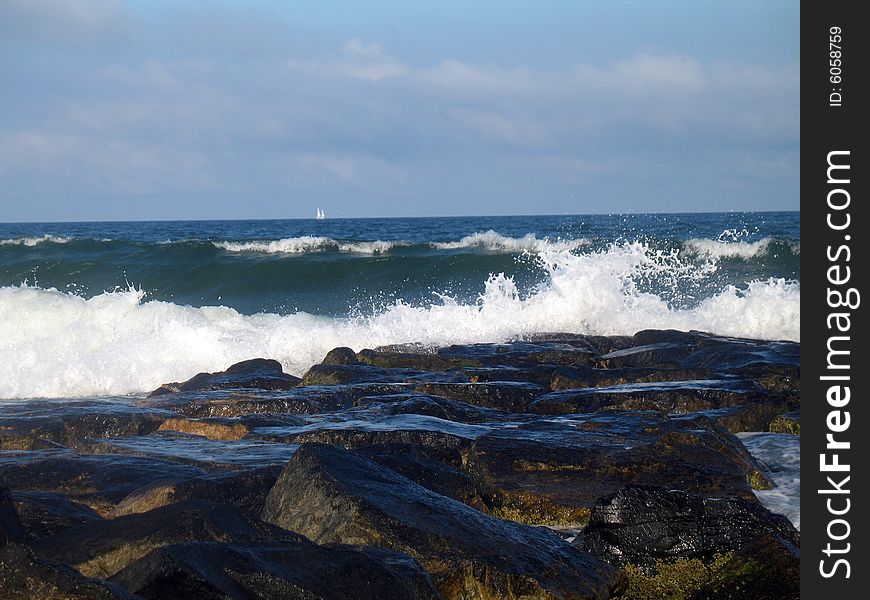Ocean waves rocks sail beach