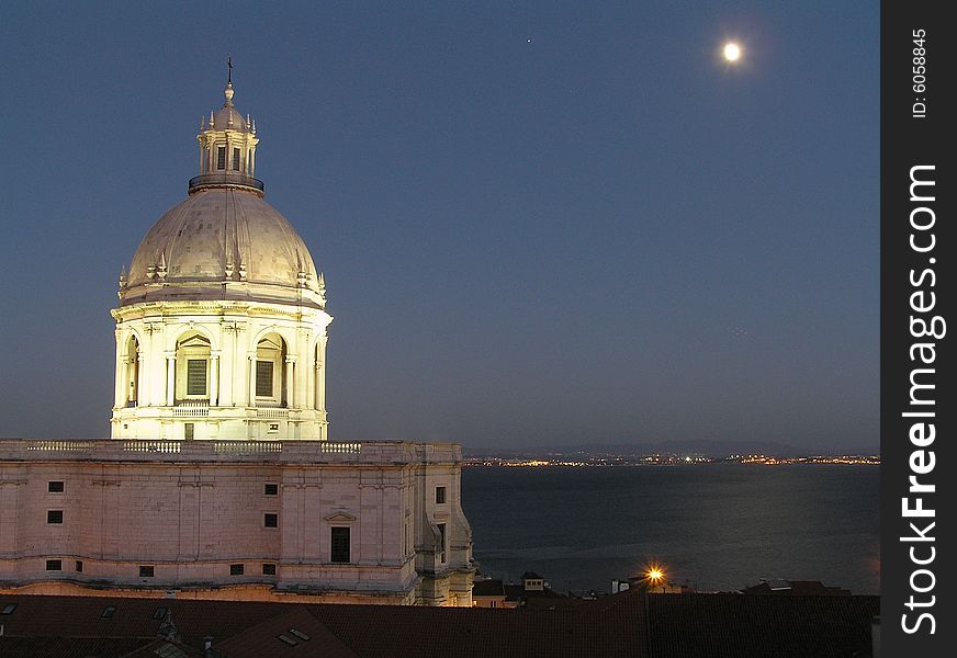 Night view of the National Pantheon, also known as Santa Engracia Church in Alfama, Lisbon with the Tejo river in the background. Night view of the National Pantheon, also known as Santa Engracia Church in Alfama, Lisbon with the Tejo river in the background