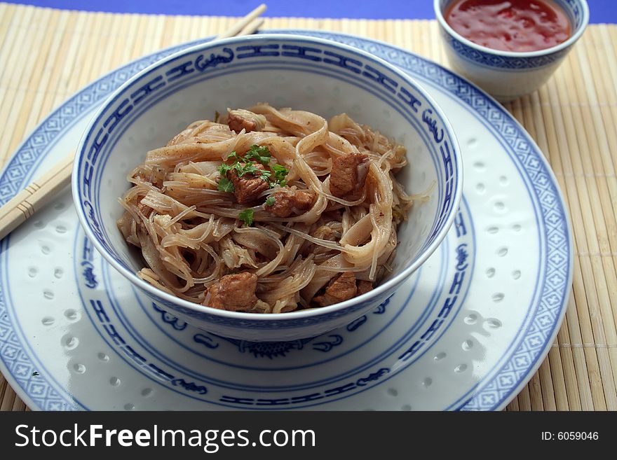 Chinese food with noodles, meat and chilisauce. Chinese food with noodles, meat and chilisauce