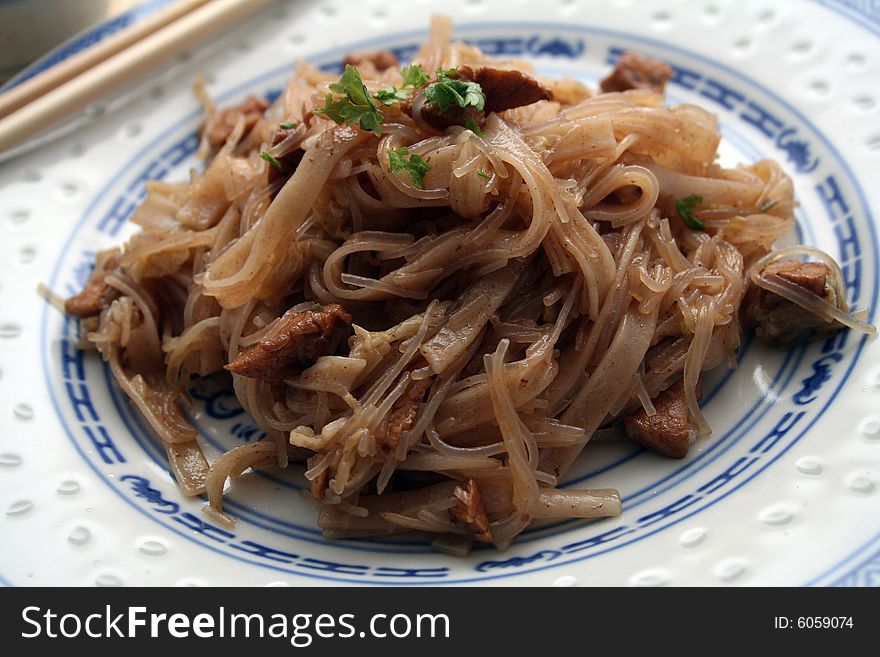 Chinese food with noodles, meat and chilisauce. Chinese food with noodles, meat and chilisauce