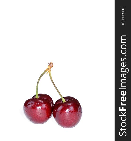 Pair of fresh colorful cherries isolated on white
