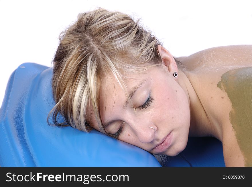 Woman resting in spa between after seaweed body treatment